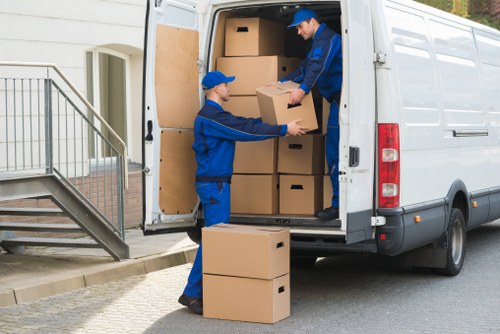 Careful unloading and placement of boxes at a new Queens Park flat