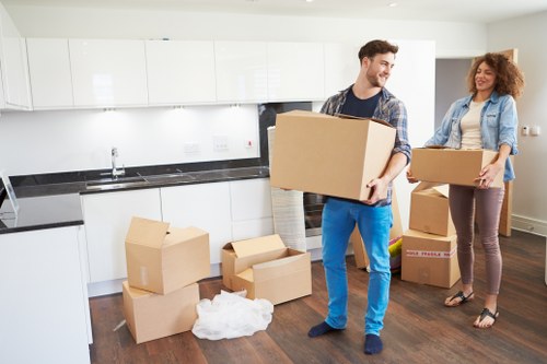 Careful packing and handling of office equipment during a Queens Park move