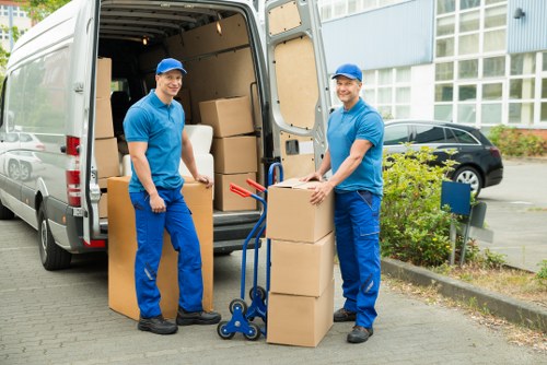 Packed boxes and furniture prepared for a local house move in Queens Park