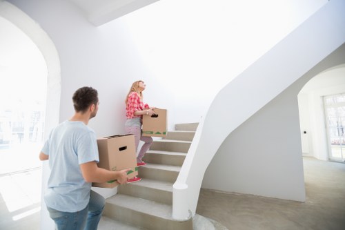 A professional local moving team assisting with a house relocation in Queens Park