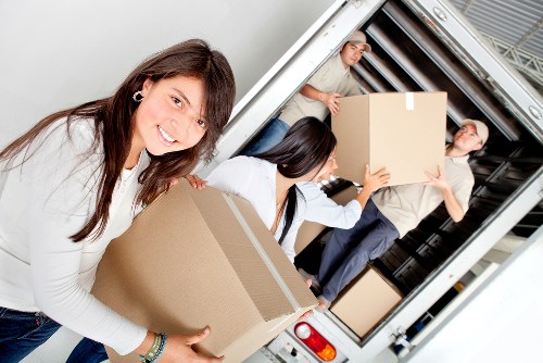Piano delivery service positioning an instrument in a Queens Park home