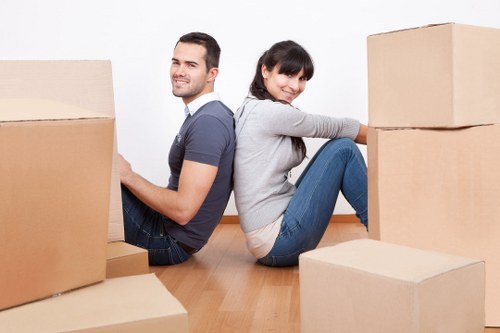 Packed boxes and furniture prepared for a Queens Park home relocation