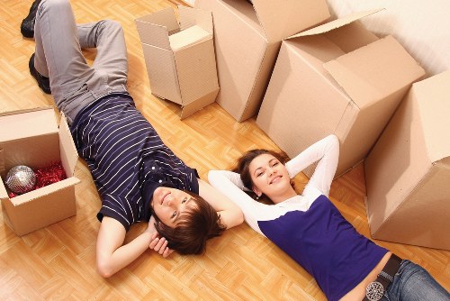 Professional removals crew handling boxes and furniture on the same day