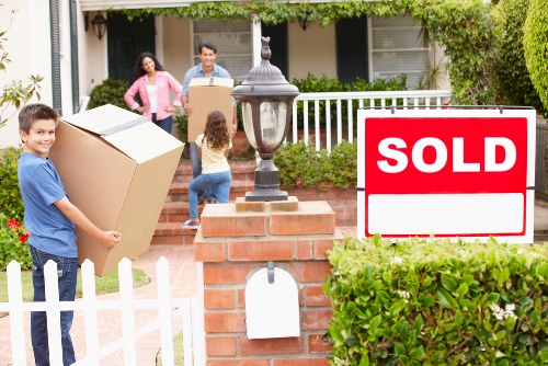 Careful loading of student belongings for a move from a Queens Park flat